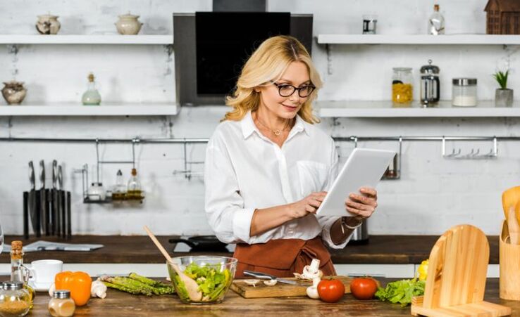 Woman with gout making a diet menu